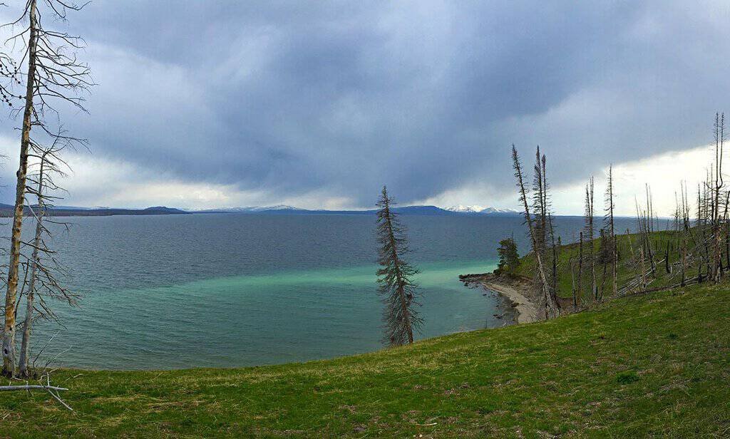 turquoise lake viewed from a roadside pull-off