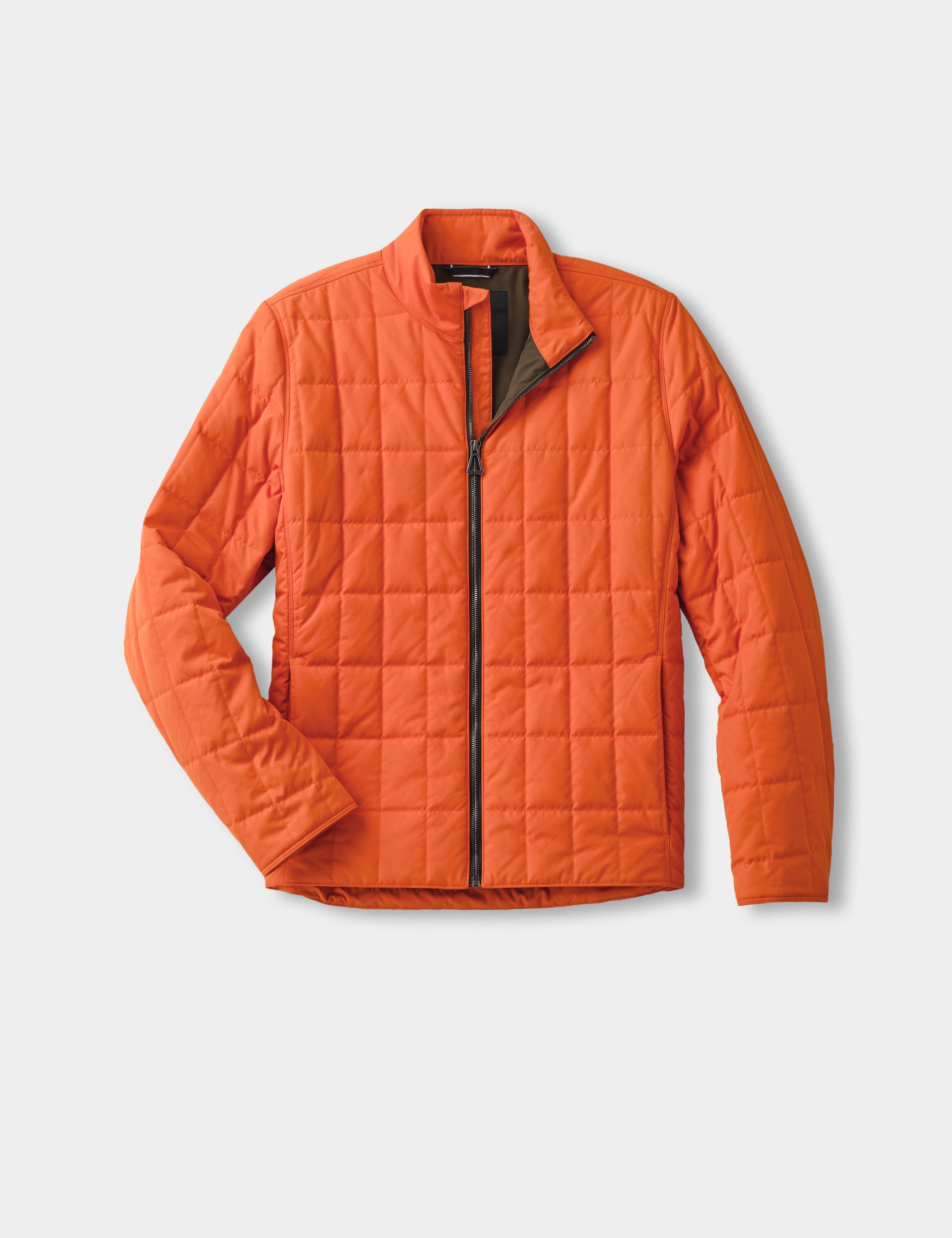 A warm insulated jacket packed for a cold mountain drive